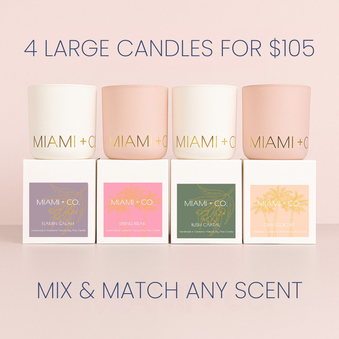 Miami &amp; Co candles with packaging on a light pink background